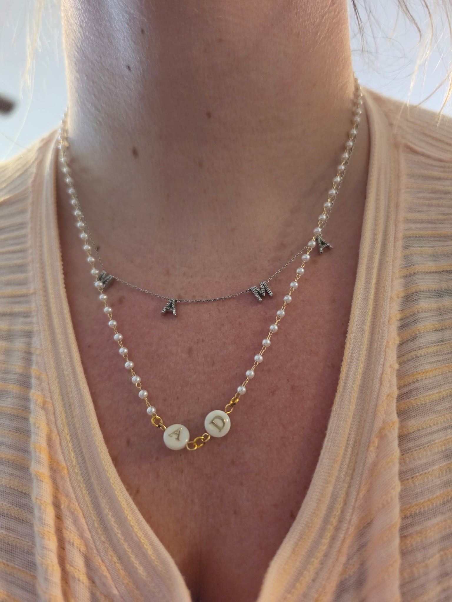 Layered pearl necklaces